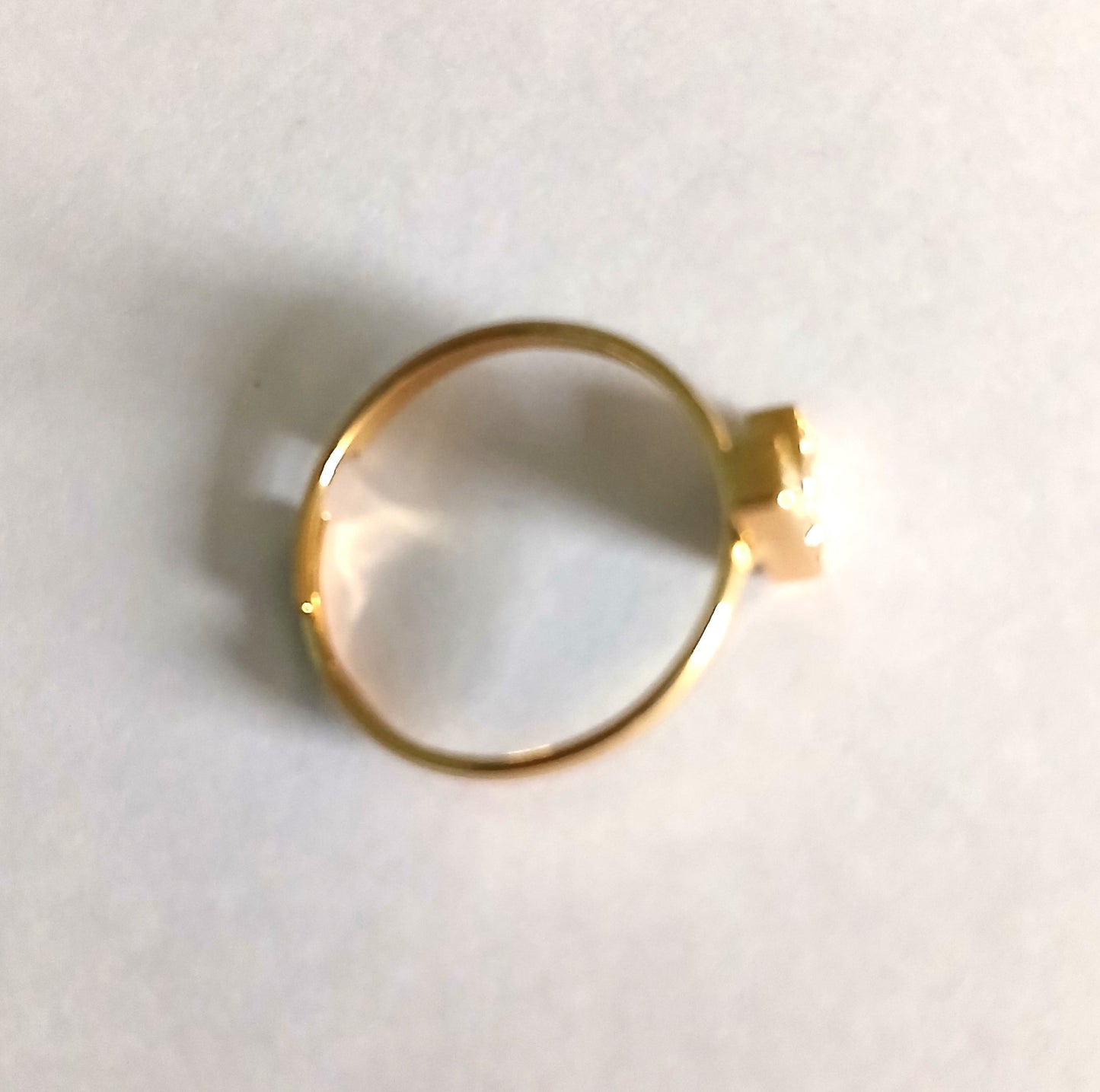 Gold-Colored Ring with Letter "L" Adorned with Shining Small Gemstones