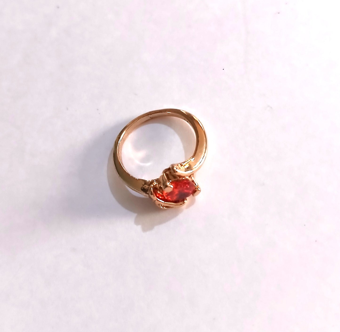 Gold-Colored Ring featuring a Red Ruby Stone