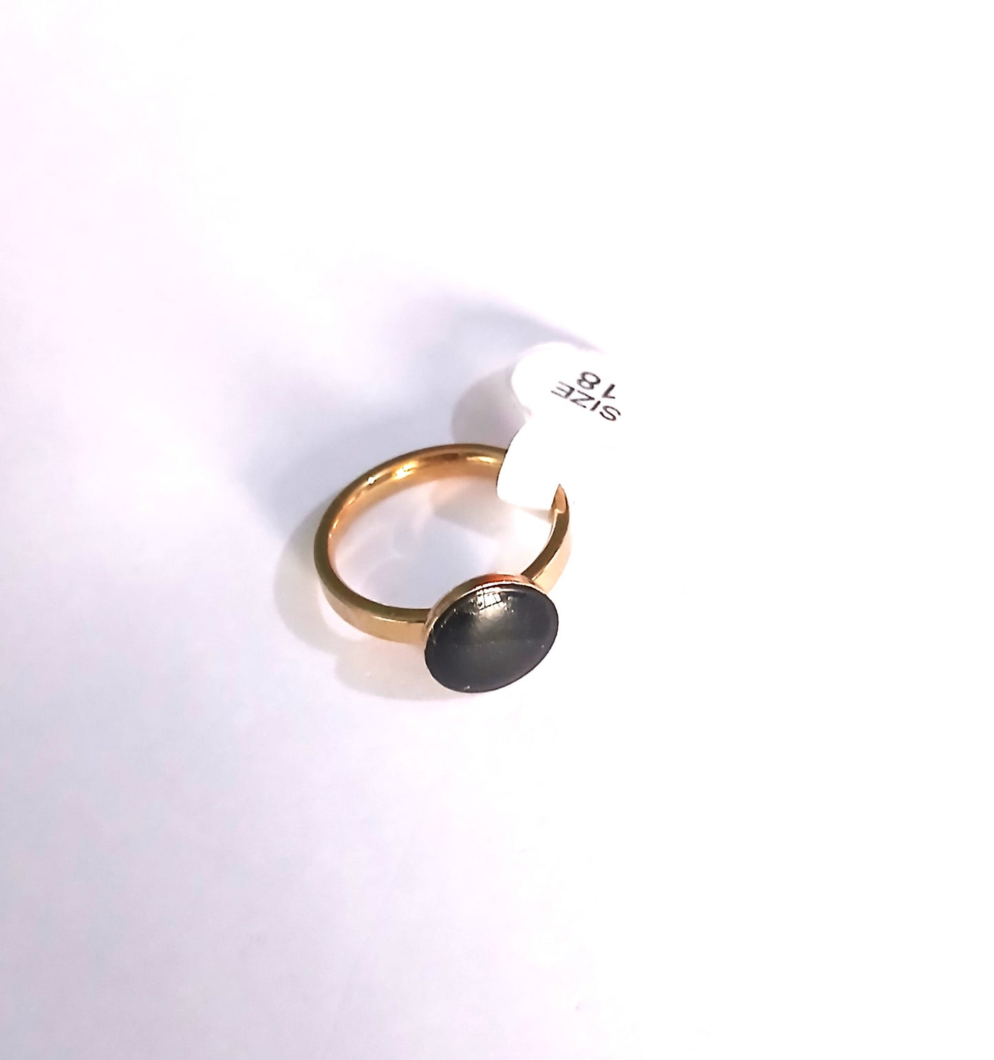 Gold-Colored Ring with Round Black Design