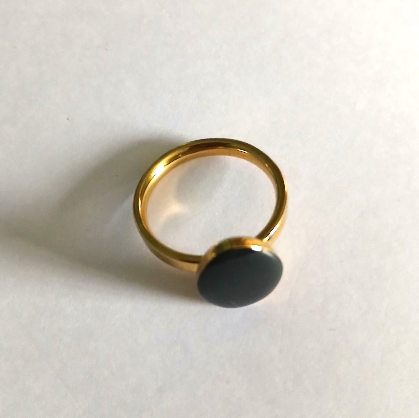 Ring with a Black Bead  in an Elegant Egg Shape