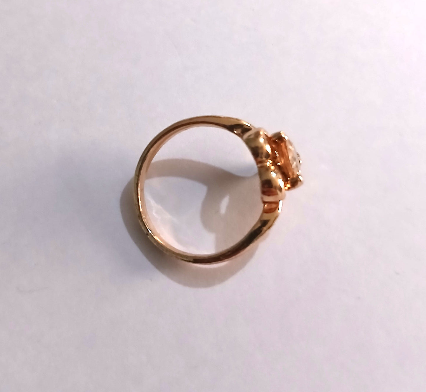 Gold-Colored Ring with a Heart-Shaped Design with a Sparkling Topaz Gemstone.