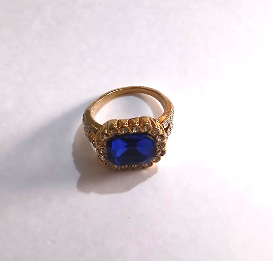 Blue Topaz Gemstone Ring Set in a Shimmering Gold Color