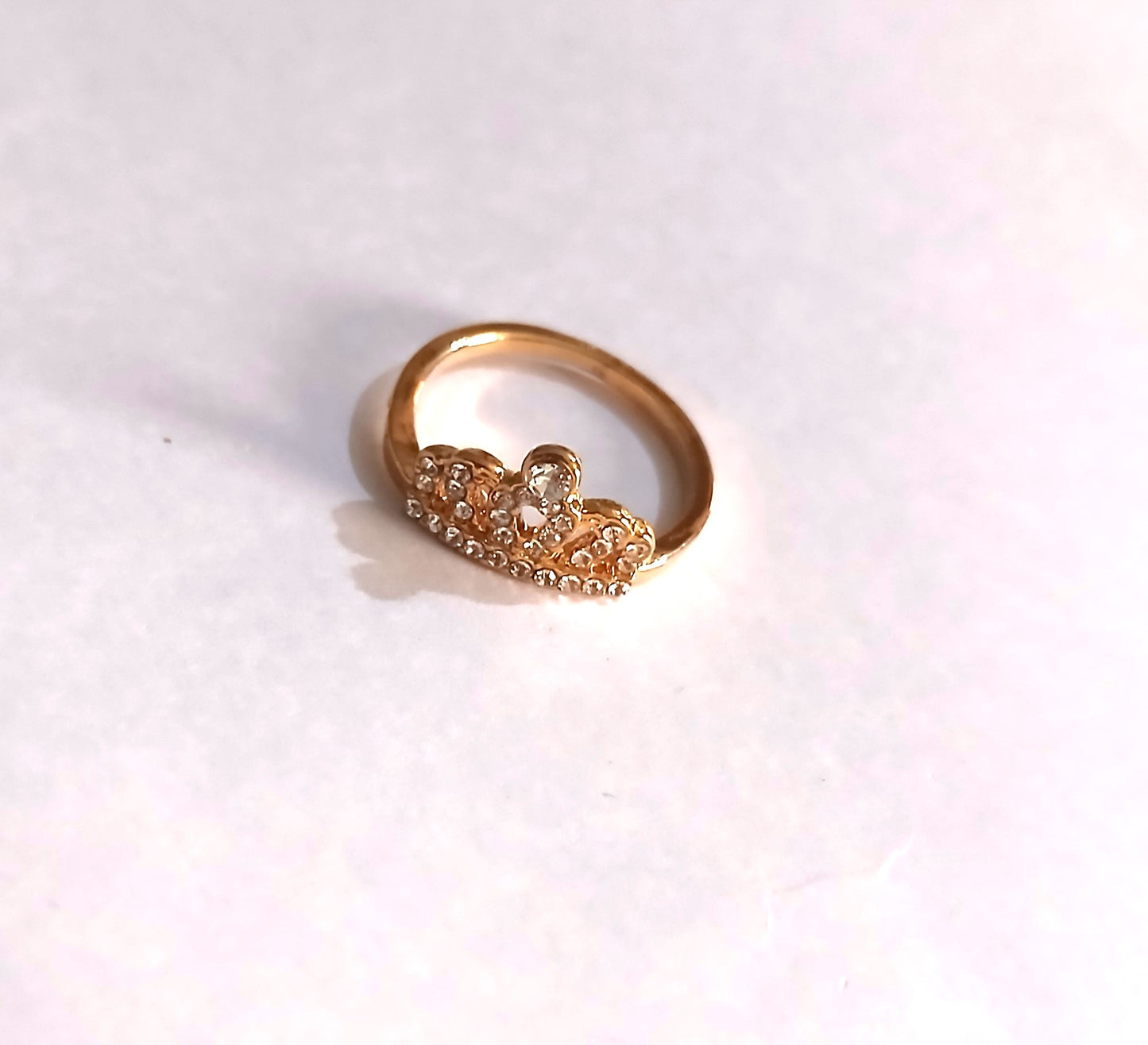 Dazzling Gold-Colored Crown Ring with Shiny Gemstones,