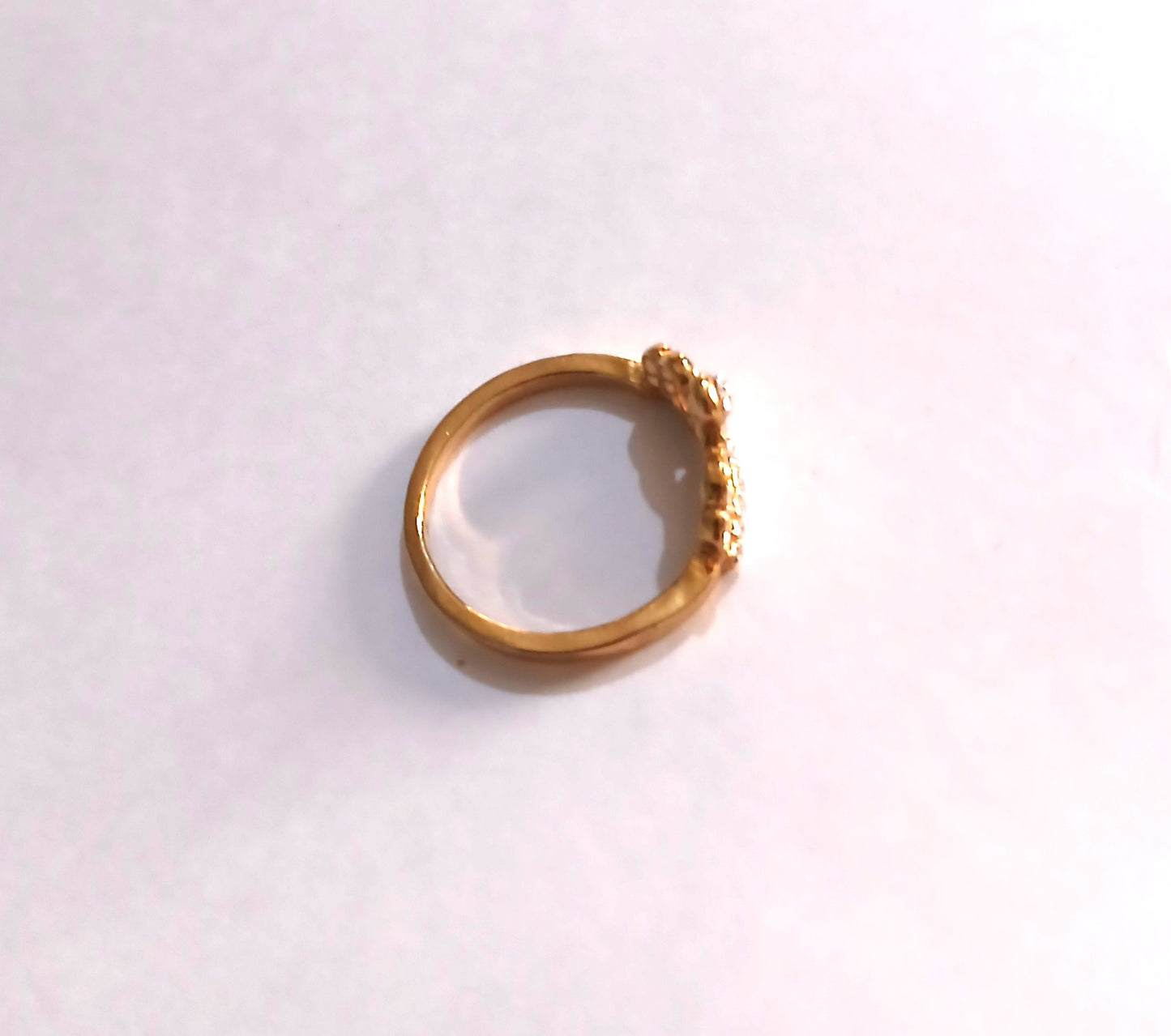 Dazzling Gold-Colored Crown Ring with Shiny Gemstones,