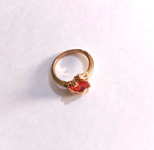 Gold-Colored Ring featuring a Red Ruby Stone