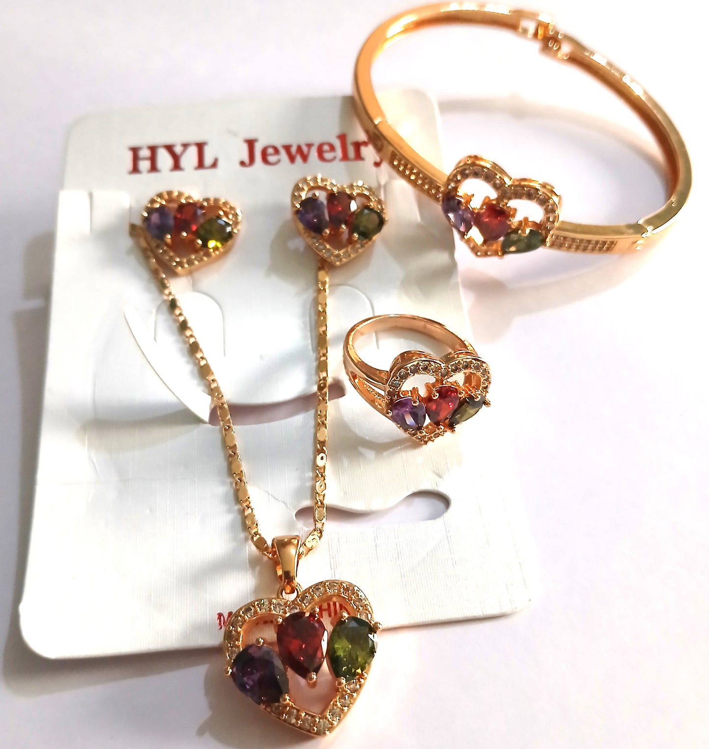 Jewelry Set Featuring a Statement Ring, Bracelet, Pendant necklace, and Earrings